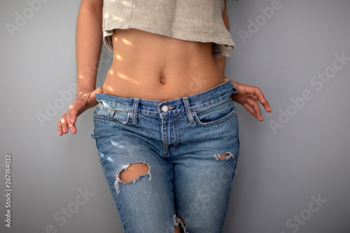 Photos Young woman sexy body in jeans