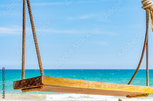 empty rope swing at summer beach day.Joy life freedom holidays for honeymoon concept