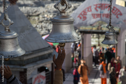Large silver temple bells at the temple of Goddess Ganga in Gangotri, India. photo