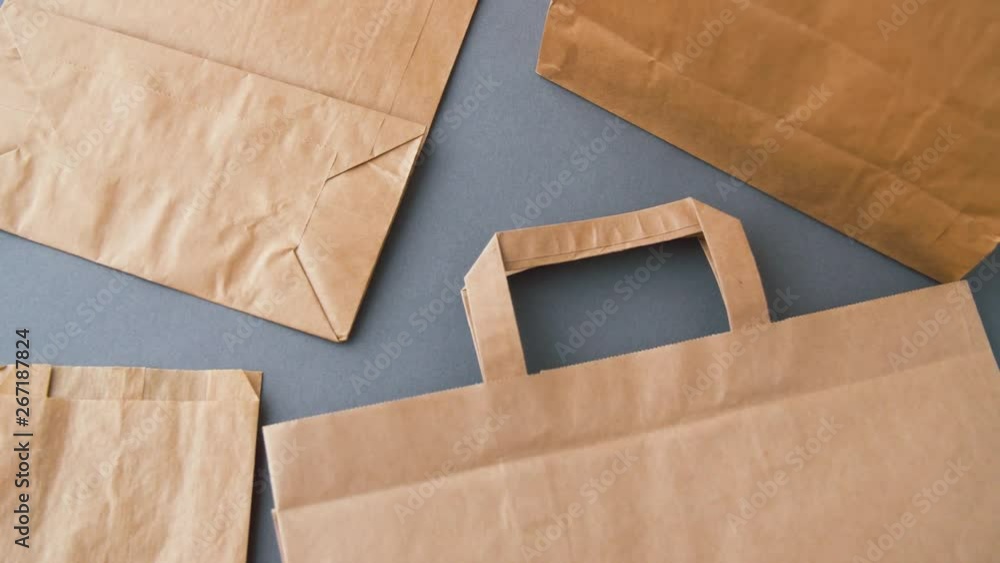 recycling, reuse and ecology concept - disposable brown paper bags on ...