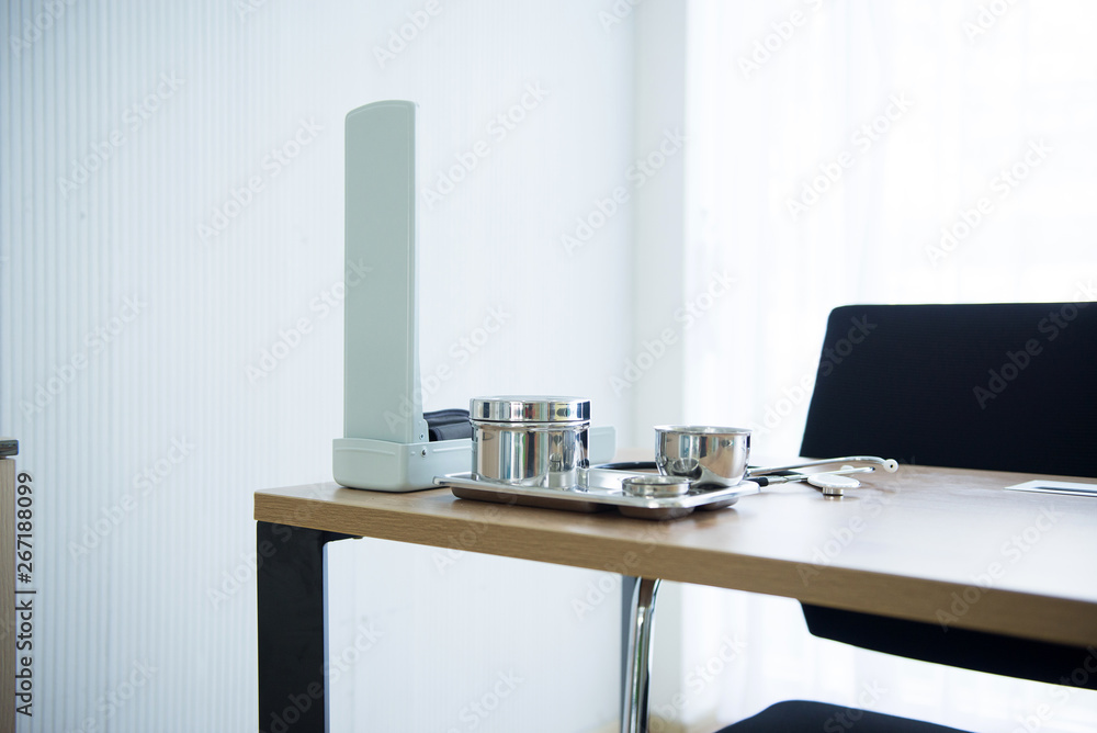 Fototapeta premium Doctor desk with equipment medical in room at hospital,Close up