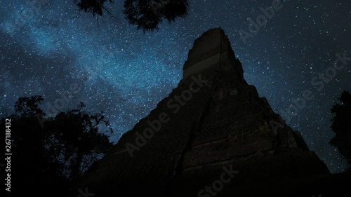 Tikal by Night with Stars and Milky Way: Ruin of Ancient Pyramid of pre-Columbian Maya civilization (Yax Mutal), in Rainforest of  Guatemala