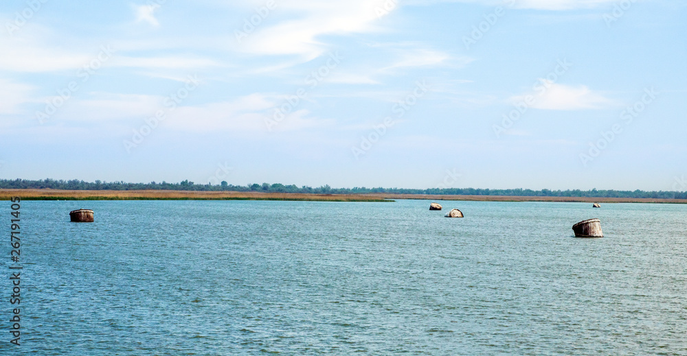 old big mooring buoys in the bay near danube delta