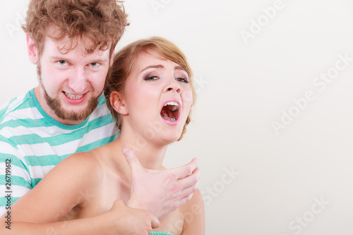 Angry man strangling screaming woman, violence photo