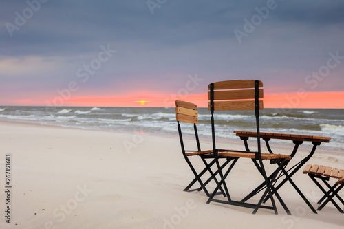 Relaxation place on sandy beach © Voyagerix