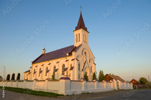 The ancient church of the Holy Trinity and the Holy Cross in April evening. Kossovo, Belarus