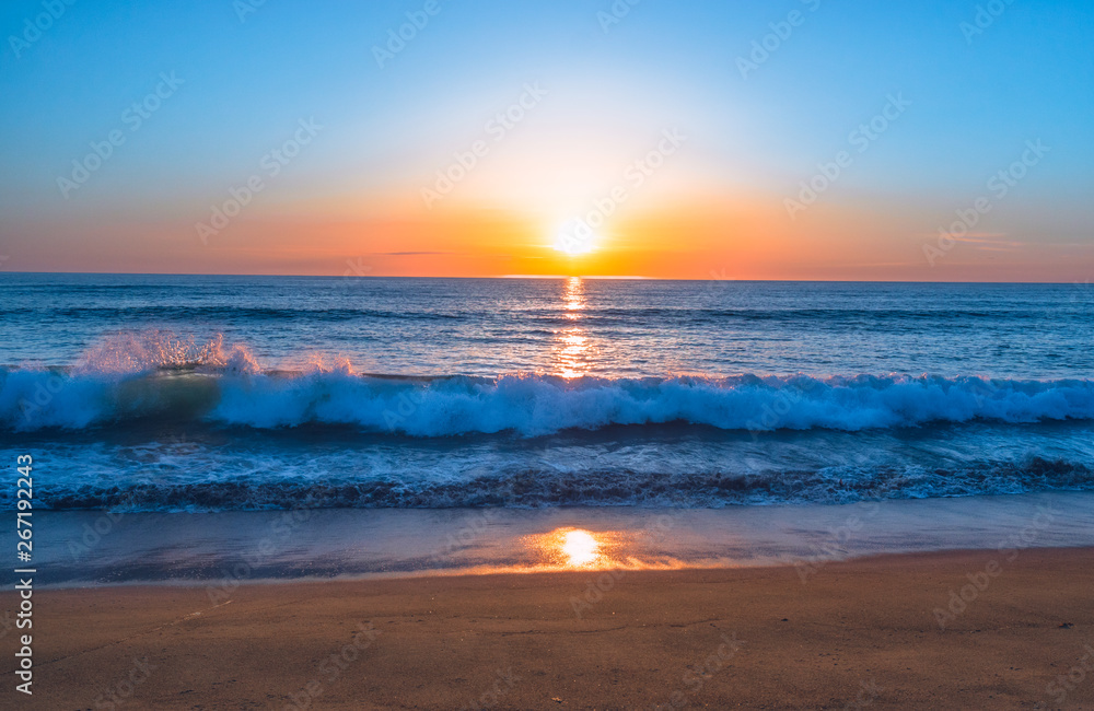 Beautiful Sunset on the Beach in Blue, Pink, and Orange Colors