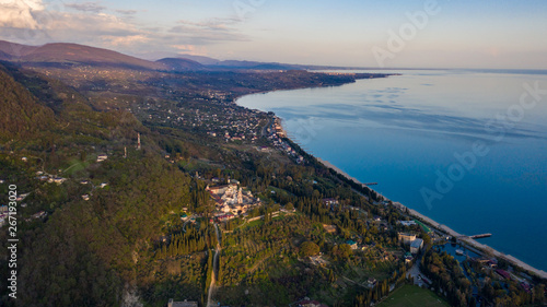Aerial photography. New Athos monastery. Abkhazia. View of the black sea coast. Sunset over the sea and shore.