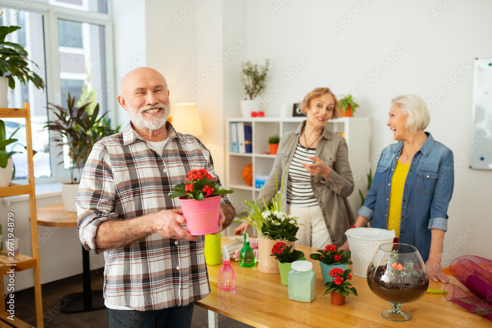 Cheerful positive senior man smiling to you Cheerful positive senior man smiling to you
