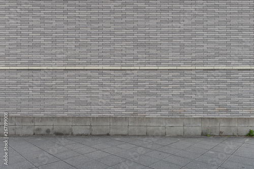 street wall background ,Industrial background, empty grunge urban street with warehouse brick wall © RobbinLee