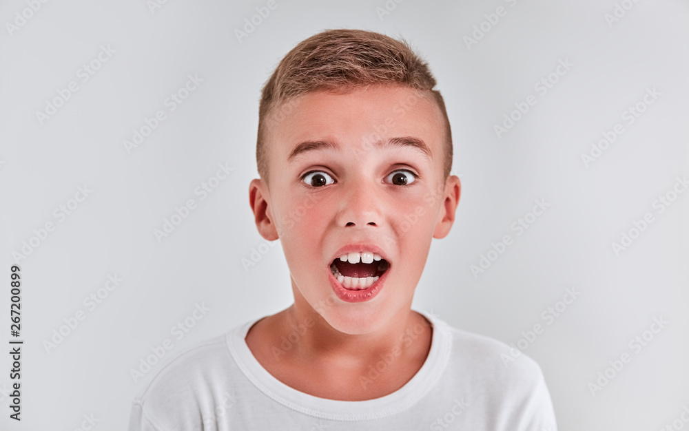 Cute boy on a gray background Cute boy on a gray background