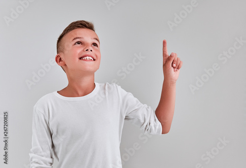 Cute boy on a gray background