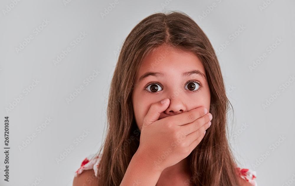 Cute girl on a gray background Cute girl on a gray background