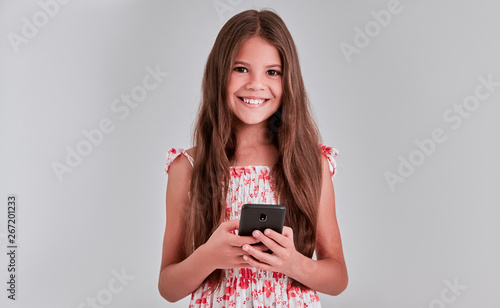 Cute girl on a gray background