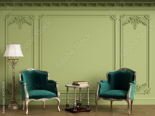 Classic armchairs in classic interior with empty classic frame on the wall.Green Gamma