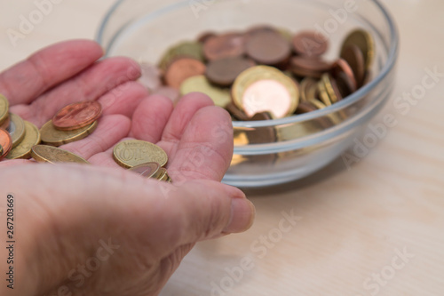 hands holding coins, saving concept