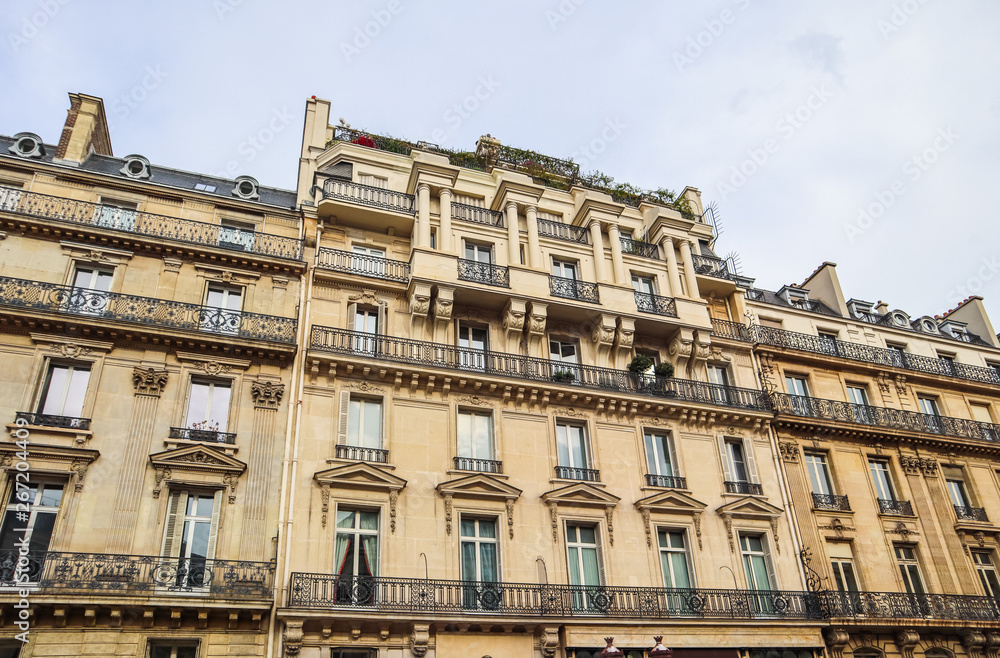Architecture of Paris France. Facade of a traditional apartment building