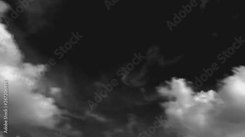 Time lapse,Slow motion the white fluffy clouds moving on a black background