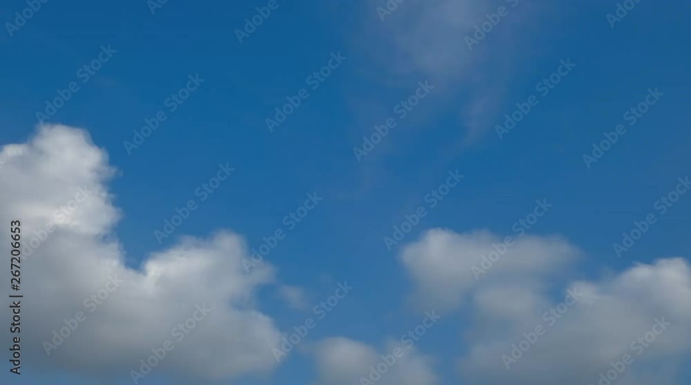 Blue sky background with white clouds slow motion is time lapse Blue sky background with white clouds slow motion is time lapse