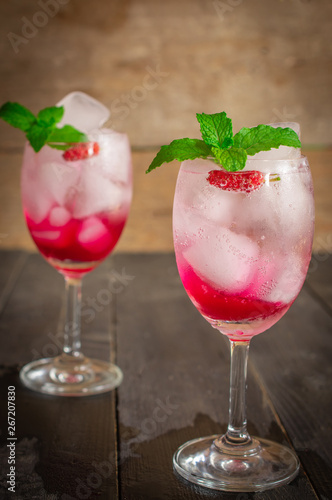 Fresh Ice Mulberry Soda drink on the wood table there is same object placed back side.