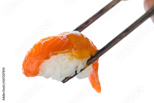 Japanese sushi with salmon and spicy sauce on sticks isolated on white background. Healthy diet.
