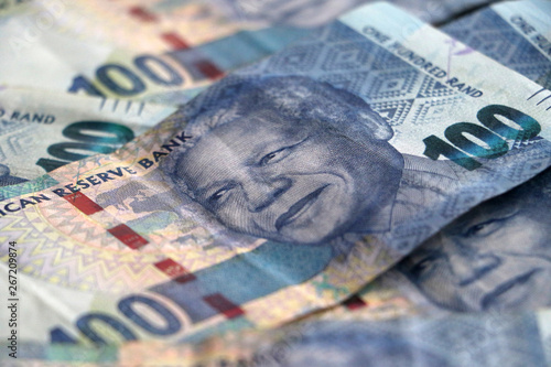 South African rand notes stacked piled up
