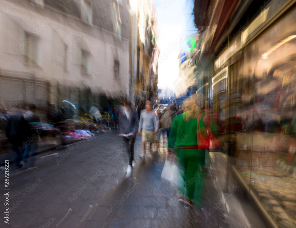 Busy city people going along the street. Intentional motion blur