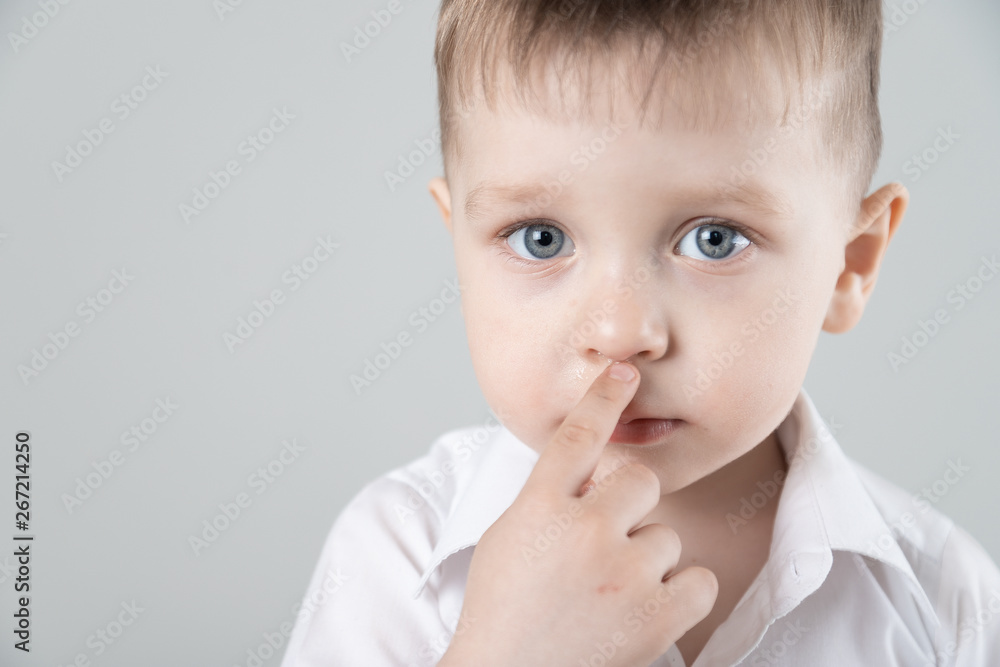 child has a runny nose with clear snot Horizontal child has a runny nose with clear snot Horizontal