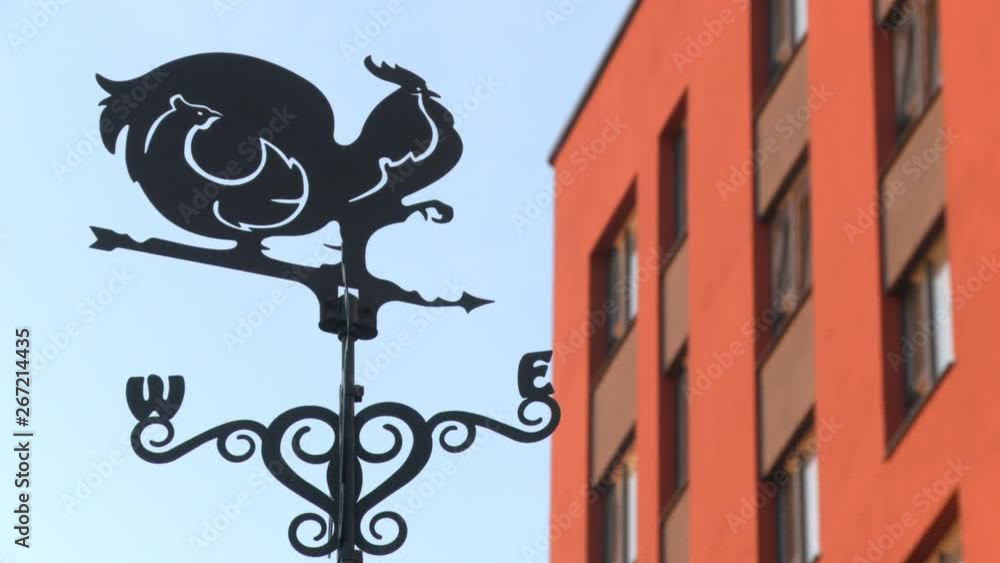 Metal street weather vane low angle view Metal street weather vane low angle view