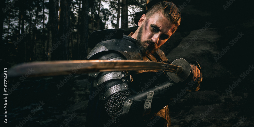mystery scarface knight in armor with sword and crossbow in the forest mystery scarface knight in armor with sword and crossbow in the forest
