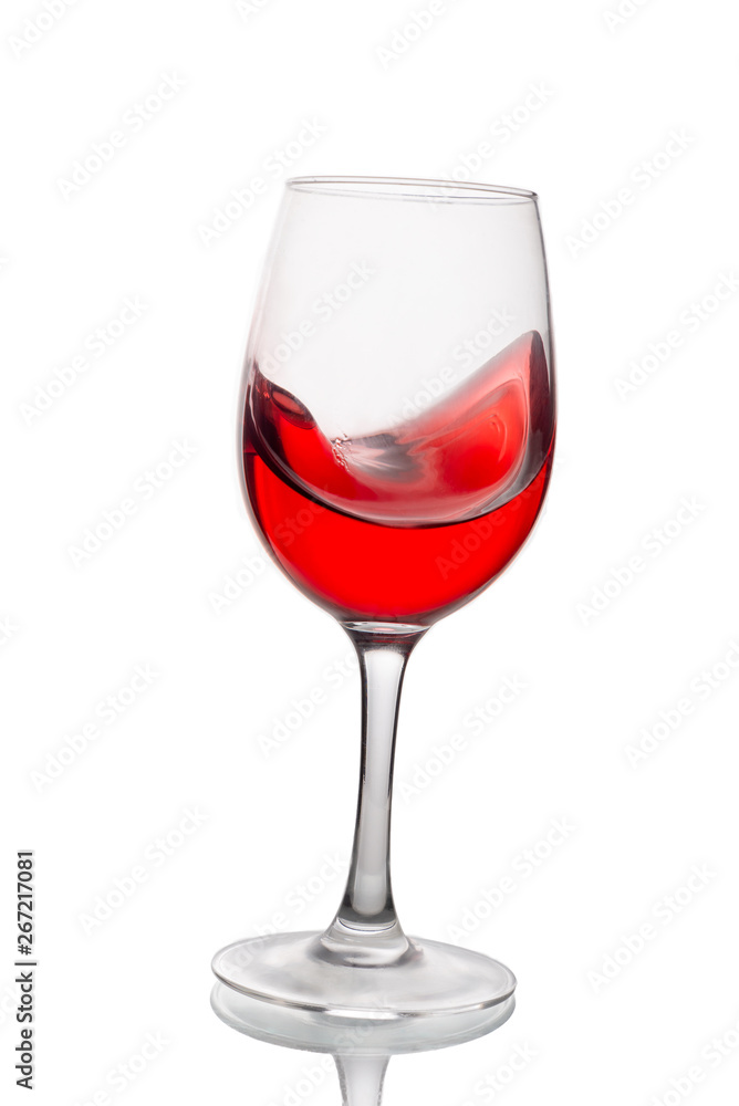 Red wine in a glass isolated on white background. Side view. Red wine in a glass isolated on white background. Side view.