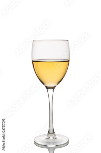 Wine glass with white wine half full.