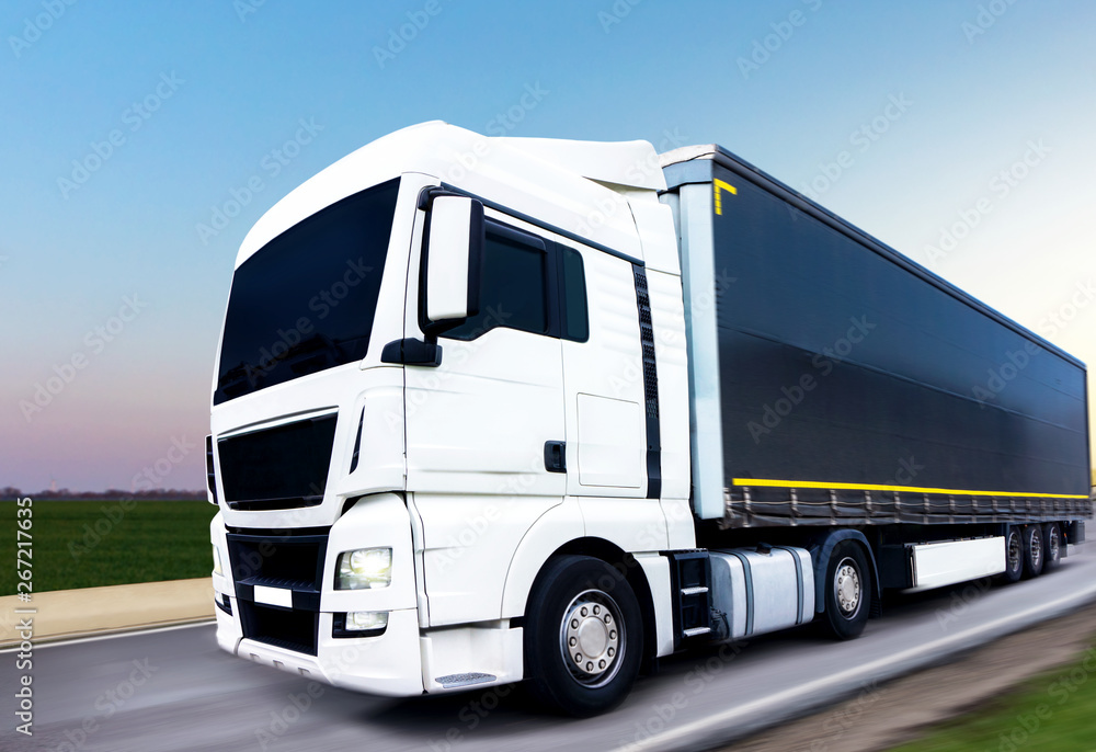 Truck on the road . Commercial transport . truck transport container