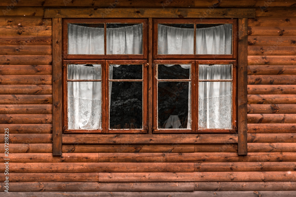 Log cabin wall with window