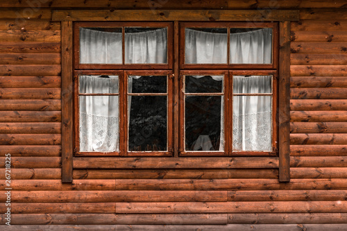 Log cabin wall with window