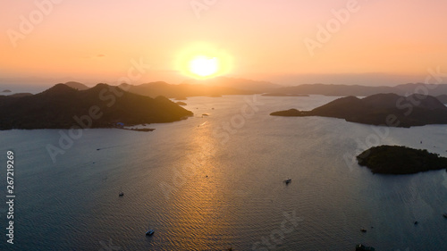 Sunset over the sea with islands. Philippine Islands in the evening aerial view
