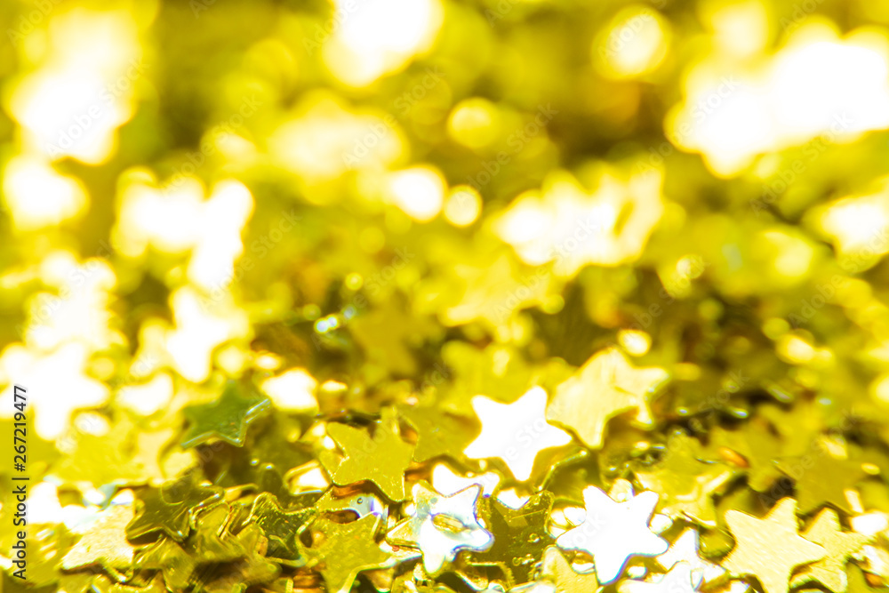 Obraz premium Gold glitter stars texture. Festive sparkling sequins background. Wpaper for Valentine, New Year or Christmas Holidays.