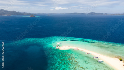 Fototapeta Naklejka Na Ścianę i Meble -  aerial seascape tropical island with sand bar, turquoise water and coral reef. Ditaytayan, Palawan, Philippines. tourist boats on tropical beach. Travel tropical concept. Palawan, Philippines