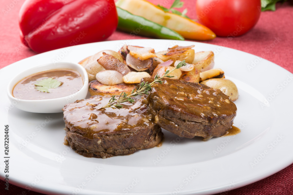 Meat cutlets served with fried potatoes