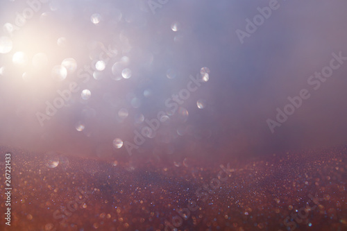 abstract glitter lights background. silver red, purple and gold. de-focused