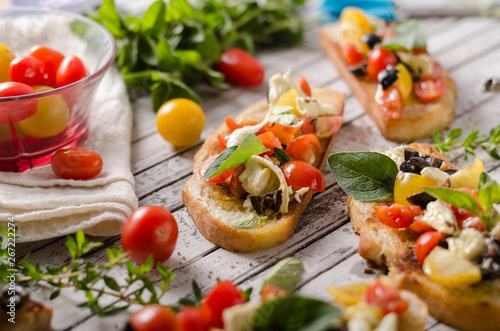 Crostini with tomatoes and olives