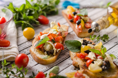 Crostini with tomatoes and olives