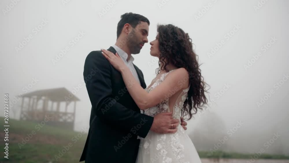 wedding couple in the mountains on a cloudy day wedding couple in the mountains on a cloudy day