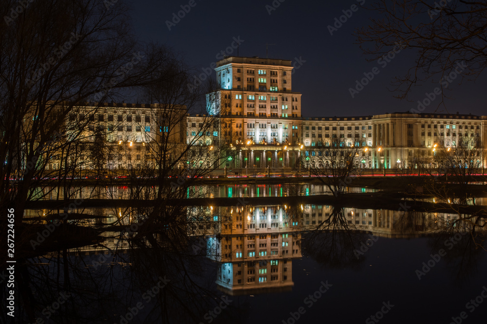 Old building reflect in the water at night