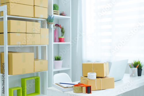 business owner working at home office packaging on background © potowizard