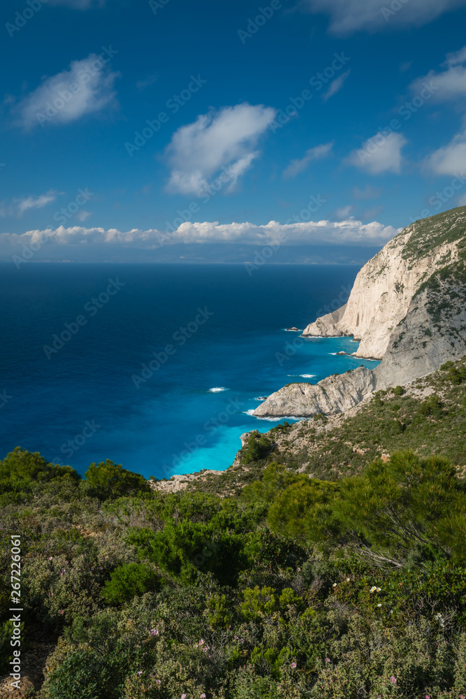 Cliffs above clear turquoise waters of Shipwreck Cove