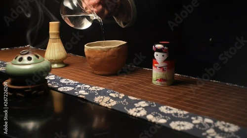 Master pours specially prepared water for cooking Japanese tea Matthia photo
