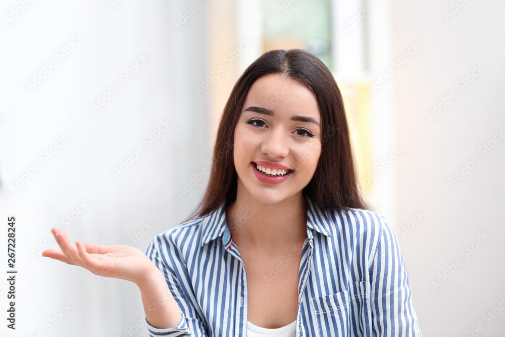 Beautiful woman using video chat for conversation indoors Beautiful woman using video chat for conversation indoors