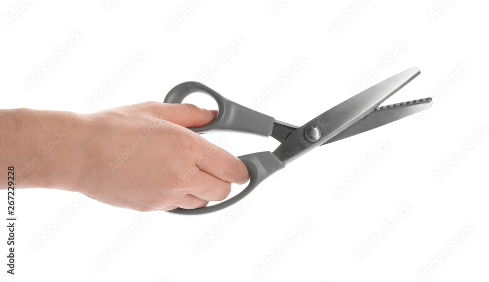 Woman holding sewing scissors on white background, closeup Woman holding sewing scissors on white background, closeup