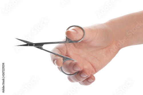 Woman holding nail scissors on white background, closeup
